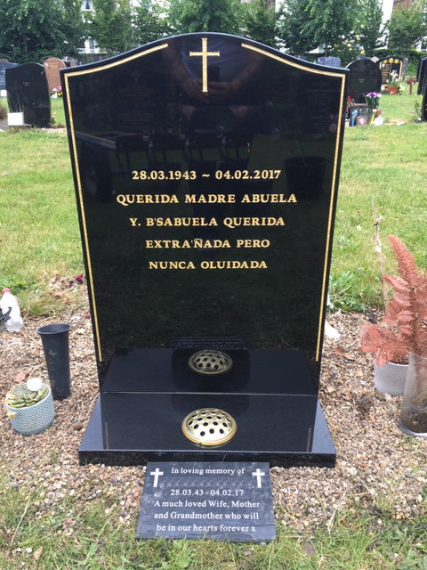 black joggle type memorial with gold pinline & cross