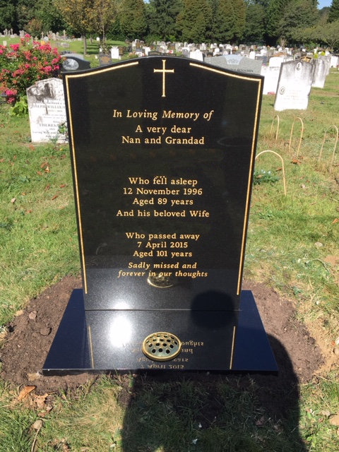 black granite lawn memorial with gold pinline & cross