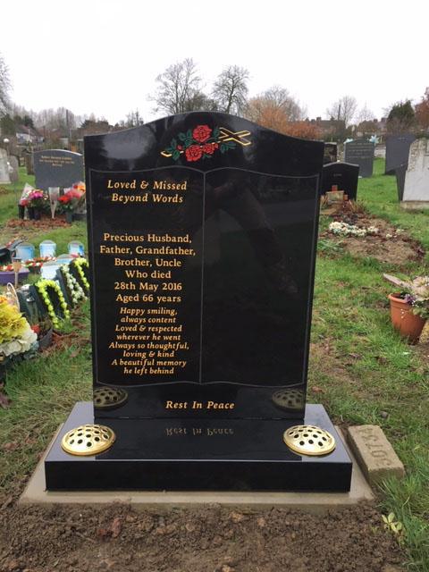 book design on black granite memorial