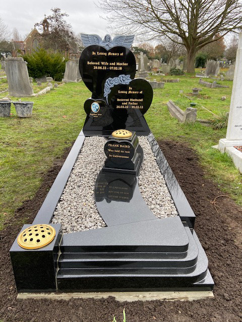 triple heart memorial in black granite with hand carved roses