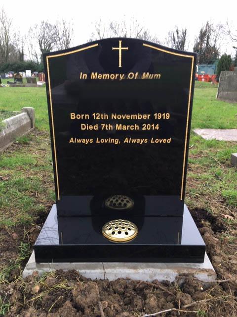 black granite lawn memorial with gold keyline & cross