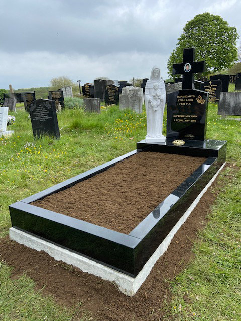 Black granite full memorial with cross & statue