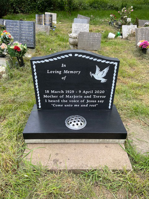 Honed cremation memorial in black granite